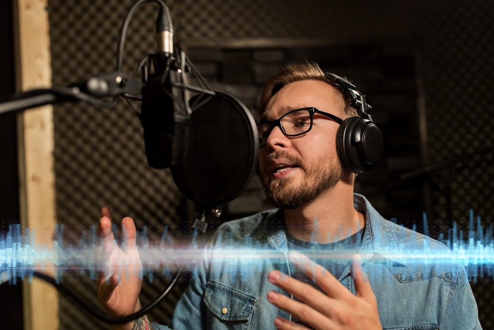 man in a podcast studio with mic headphones eggcrate