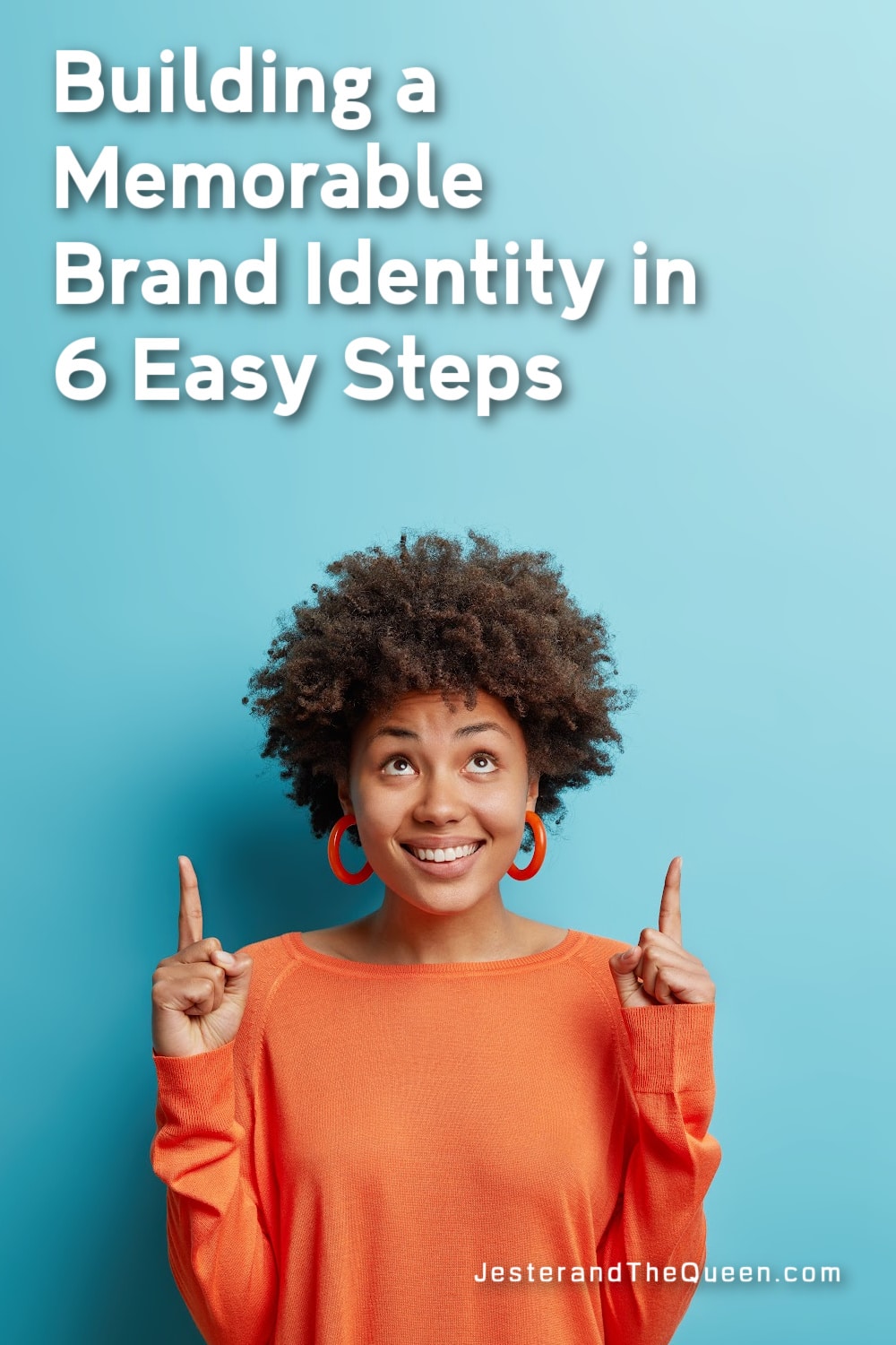 woman wearing an orange shirt pointing up to the words building a memorable brand identity in 6 easy steps