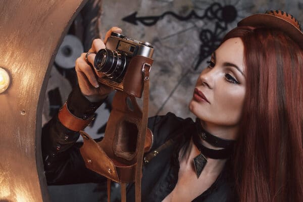 woman over 40 in cosplay holding a camera