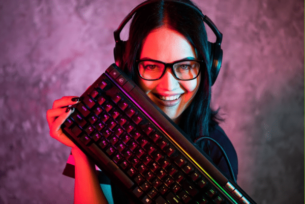 woman with a gaming keyboard setting up her streaming channel